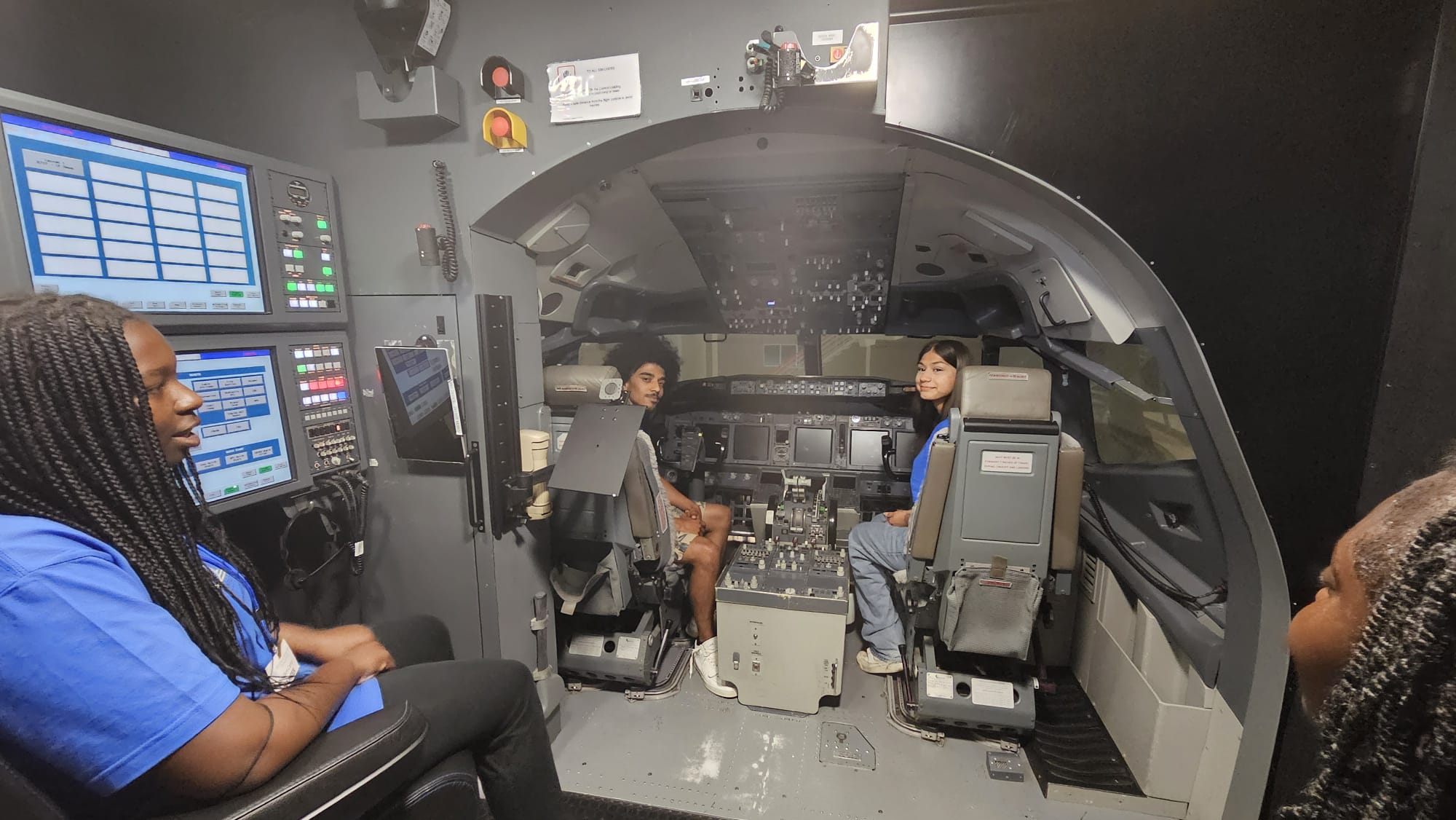Students in flight simulator